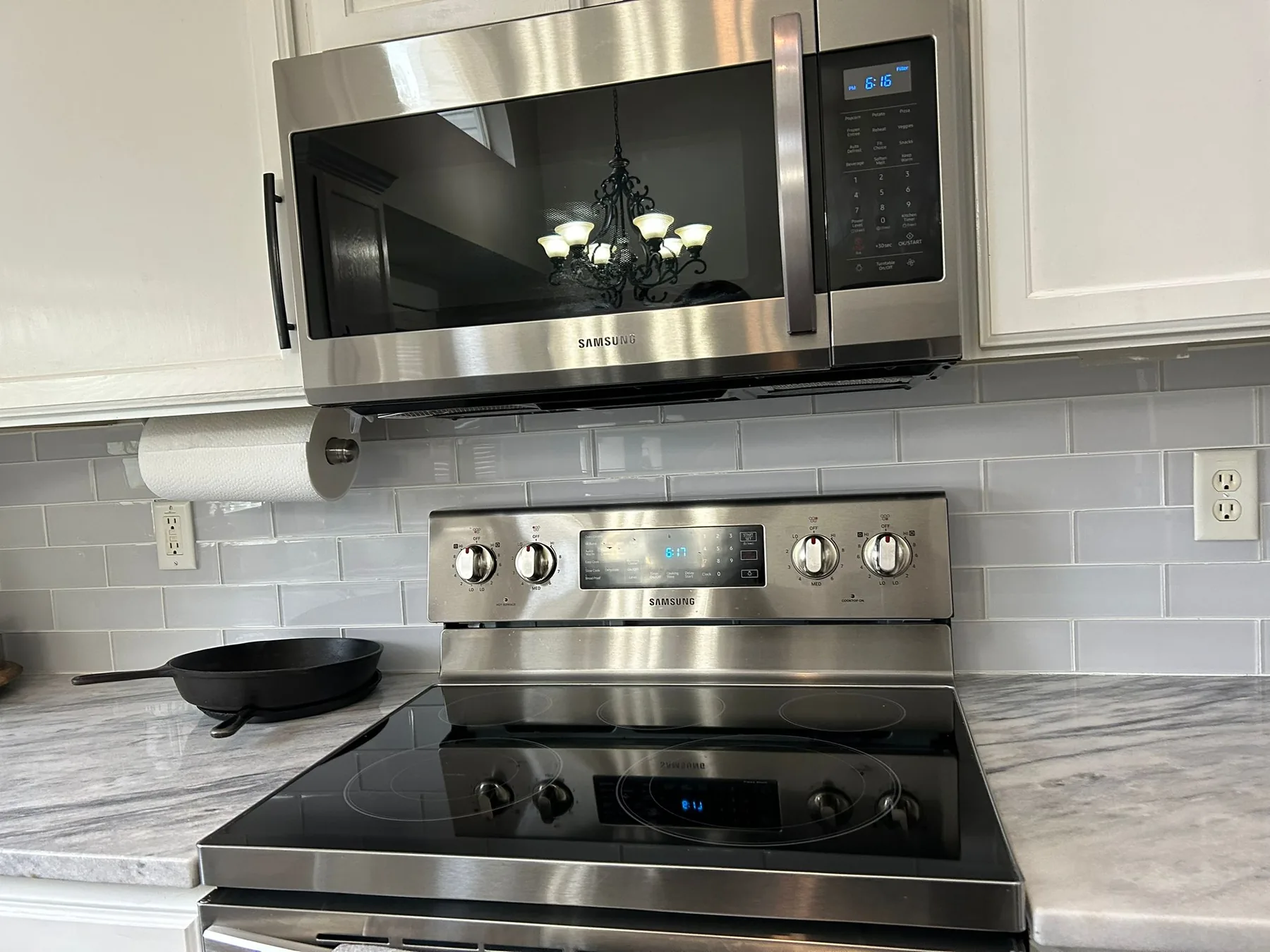 Deep-cleaned stove and microwave in a tidy kitchen