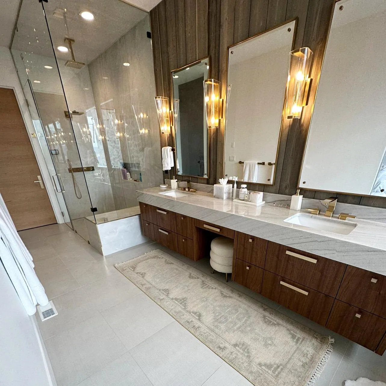 Spotless master bathroom with double vanity and glass shower